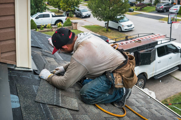 Professional Roofing technician working in Marchand, PA